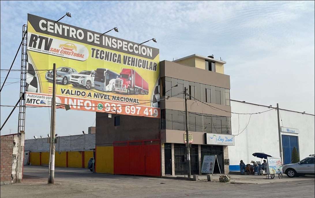 Image of a technician performing a detailed vehicle inspection